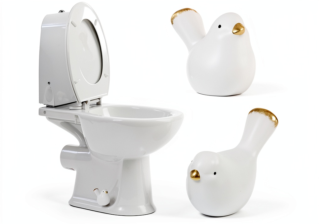 Bird-shaped ceramic bolt cover installed on a white toilet